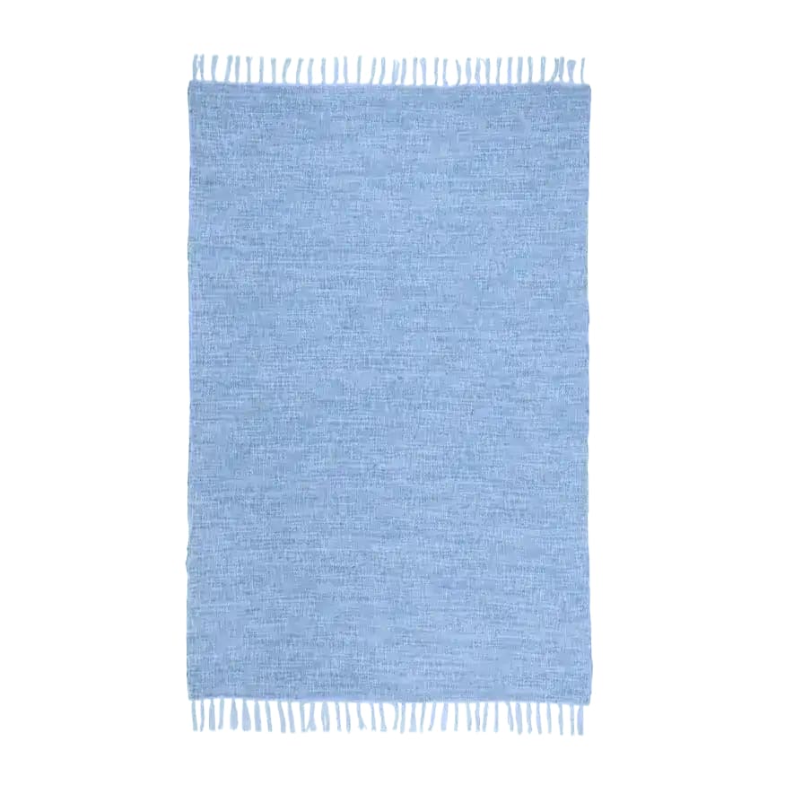 Top view of the Maia Jute and Cotton Blend Area Rug with Tassels, showcasing its elegant design and soft texture. Perfect for dining rooms, this large boho rug combines style and functionality, making it an ideal choice for those seeking jute rugs or dining room carpets.