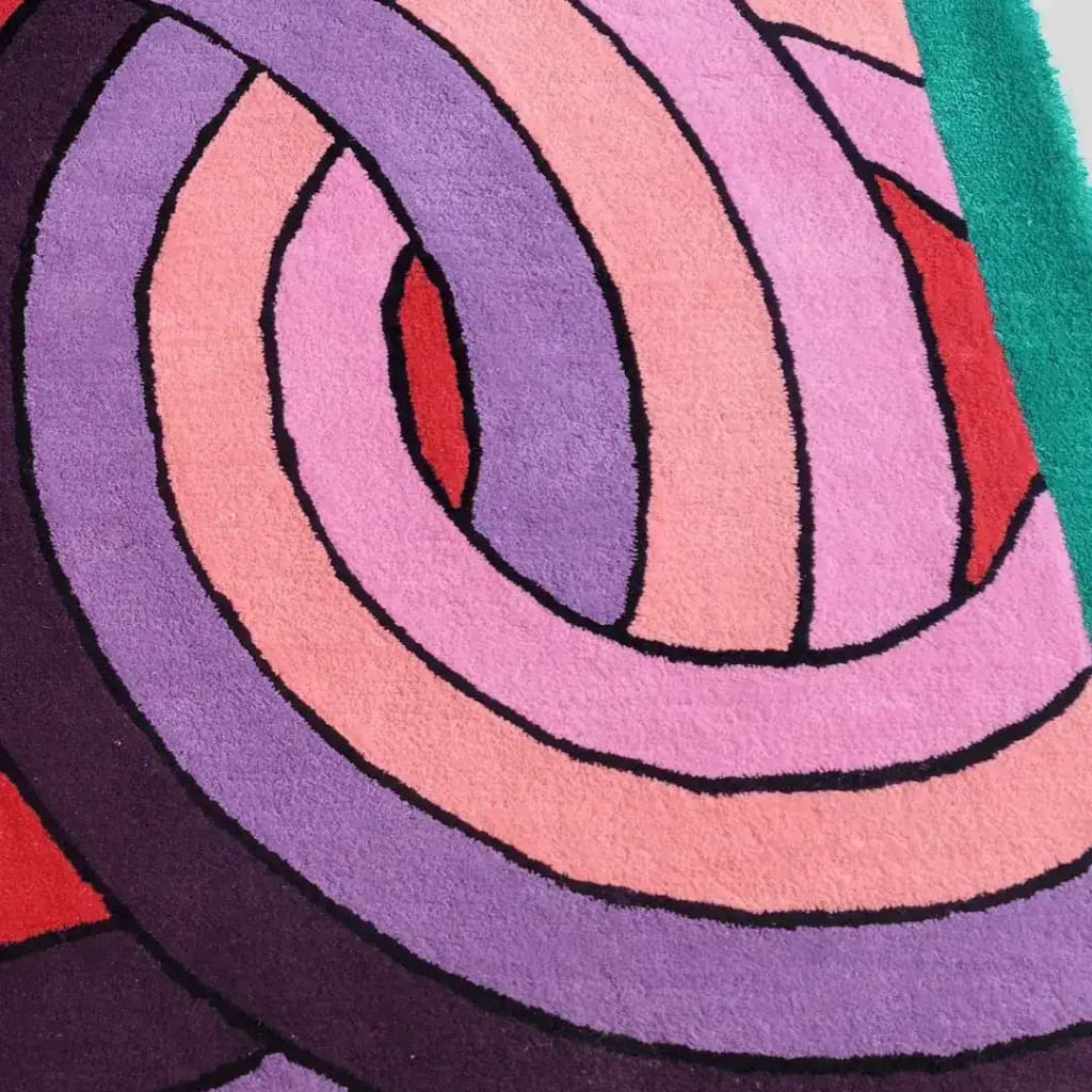 Close-up view of the Maia Knotted Circles on Square Hand Tufted Wool Rug in green. This contemporary square area rug features vibrant, overlapping circular patterns in shades of purple, pink, and red, making it an ideal choice for living rooms or offices seeking a stylish, modern touch.
