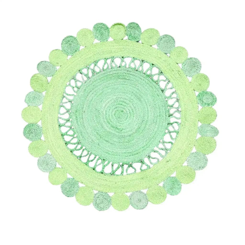 Top view of the Maia Round and Round Jute Rug in green, showcasing its intricate circular design. This area rug is perfect for adding a natural touch to living rooms. The round shape and jute material make it an ideal choice for those seeking stylish and eco-friendly rugs for the living room.