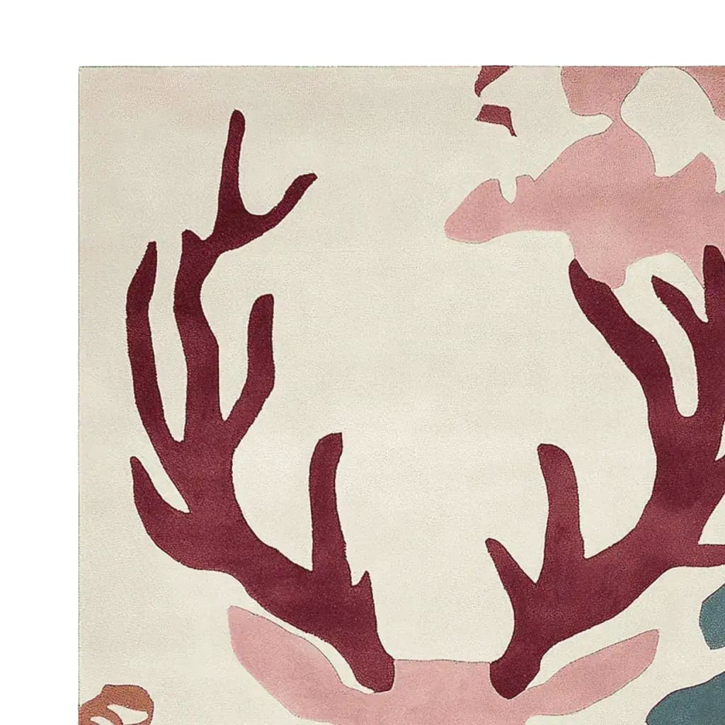 Close-up view of the Majestic Antler Hand Tufted Area Rug, showcasing its intricate wool design with abstract antler patterns in shades of red and pink. Perfect as a statement piece for living room rugs, particularly in an 8x10 size.