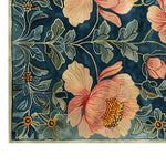A detailed view of the Majestic Blossoms Hand Tufted Wool Rug, featuring vibrant floral patterns with large pink and yellow flowers against a rich blue background. Perfect as a wool rug for enhancing large living room spaces, this vintage rug combines elegance and durability, making it an ideal choice for area rugs in any living room setting.