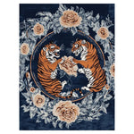 Majestic Clash Hand Tufted Rug featuring a vibrant design of two tigers surrounded by intricate floral patterns on a deep blue background. This area rug adds a touch of vintage elegance to any living room with its luxurious wool texture, making it a perfect choice for those seeking a floral rug or a vintage rug. Ideal for adding a statement piece to your area rugs collection for living room decor.