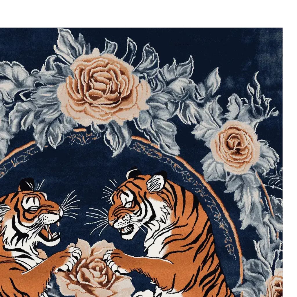 The Majestic Clash Hand Tufted Rug, a stunning area rug, showcases a vibrant design featuring two tigers amidst a backdrop of intricate floral patterns. This wool rug, perfect for adding a vintage touch to living rooms, combines detailed roses and leaves for a rich and elegant look.