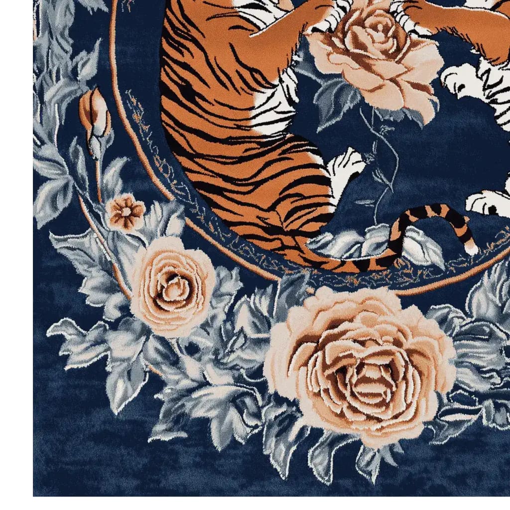 This stunning area rug features a vibrant design with an abstract depiction of tigers surrounded by intricate floral patterns. The rich blue background highlights the detailed roses and leaves, creating a vintage vibe perfect for any living room. Made from quality wool, this hand-tufted floral rug combines elegance and durability, making it an ideal choice for those seeking area rugs for living room spaces.
