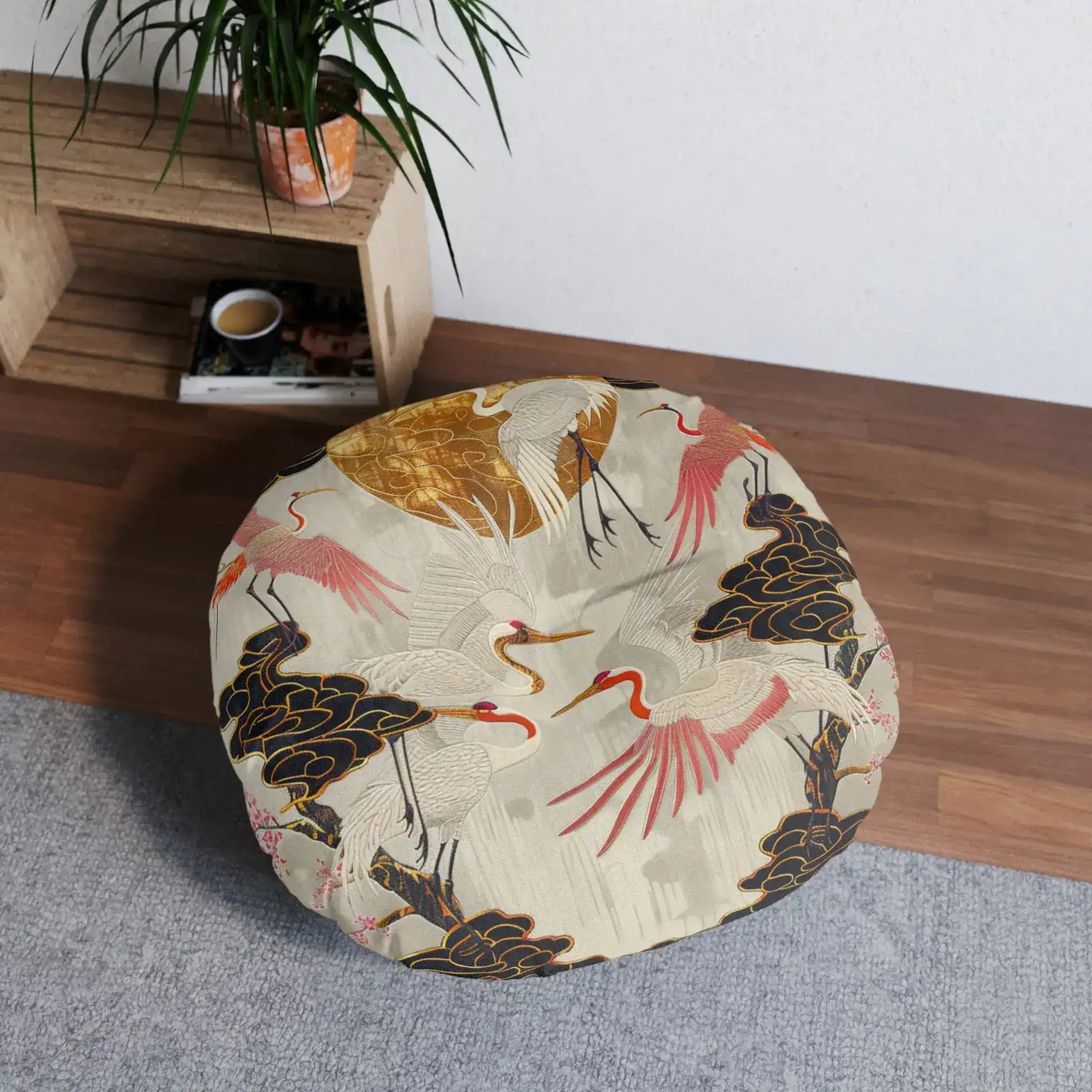 Majestic Crane and Cloud Pattern Floor Pillow on grey rug beside wooden shelf with plant slightly different overhead angle