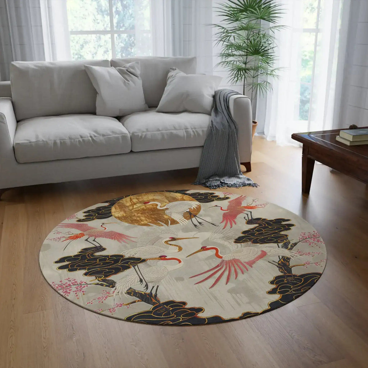Majestic Crane and Cloud Pattern Round Rug in a bright living room with gray sofa, birds and blossoms on cream ground