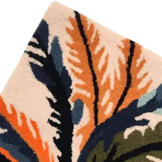 Close-up of the Majestic Jungle Dawn Hand Tufted Area Rug, showcasing vibrant abstract patterns in orange, blue, and green hues. Perfect for adding a pop of color to a dining room or as a living room rug sized 8x10, this wool rug offers a unique touch to any space.