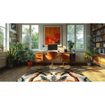 A vibrant area rug featuring an abstract jungle design is spread in a cozy home office. The wool rug adds a lively touch to the wooden floor, complementing the mid-century modern desk and orange chair. The room is illuminated with natural light from large windows, providing a perfect setting for dining room or living room rugs 8x10.
