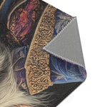Corner fold of Majestic Monarch Regal Monkey Accent Rug showing ornate gold trim on dark background with white fur and gray backing