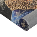 Rolled corner detail of Majestic Monarch Regal Monkey Accent Rug showing ornate crown and blue coat on dark background and gray backing