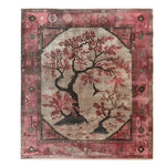 The Maple Meditations Knotted Wool Rug features a stunning floral design with intricate tree patterns in shades of red and black, set against a warm beige background. This elegant area rug is perfect for adding a touch of nature-inspired charm to your living room. Ideal for those seeking large living room rugs or floral rugs that blend art and comfort.