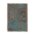 Reverse side of the Maximalist Dreamscape Woven Blanket with fringed edges showing woven back in teal blue and brown tones depicting the same opulent room scene