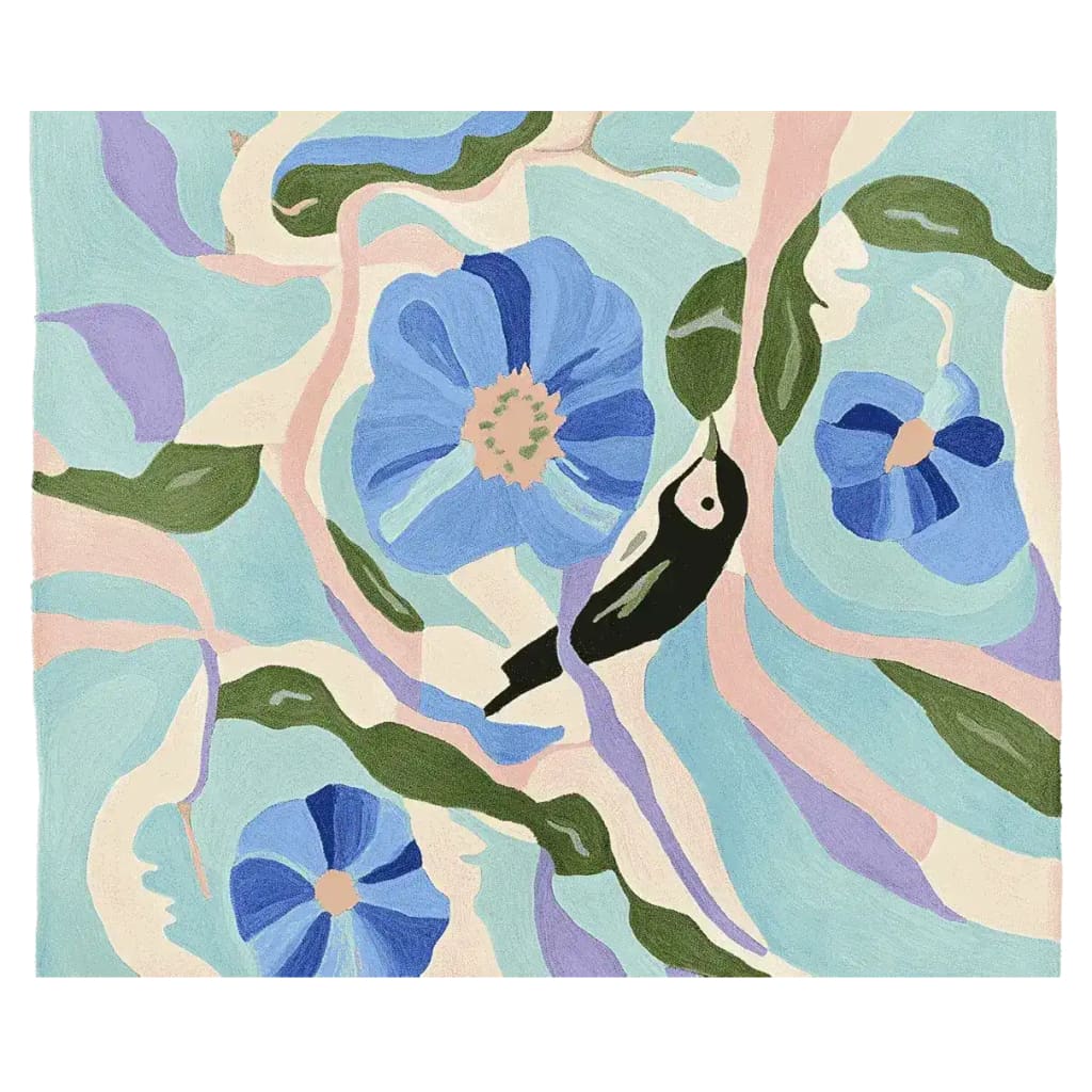 A vibrant area rug featuring a contemporary design with abstract floral patterns in blue and green hues, accented by a bird motif. This hand-tufted wool rug is perfect for adding a touch of nature-inspired elegance to a living room.