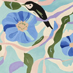 A vibrant hand tufted area rug featuring a contemporary design with large blue flowers, green leaves, and a bird. This wool rug is perfect for adding a splash of color to any living room.