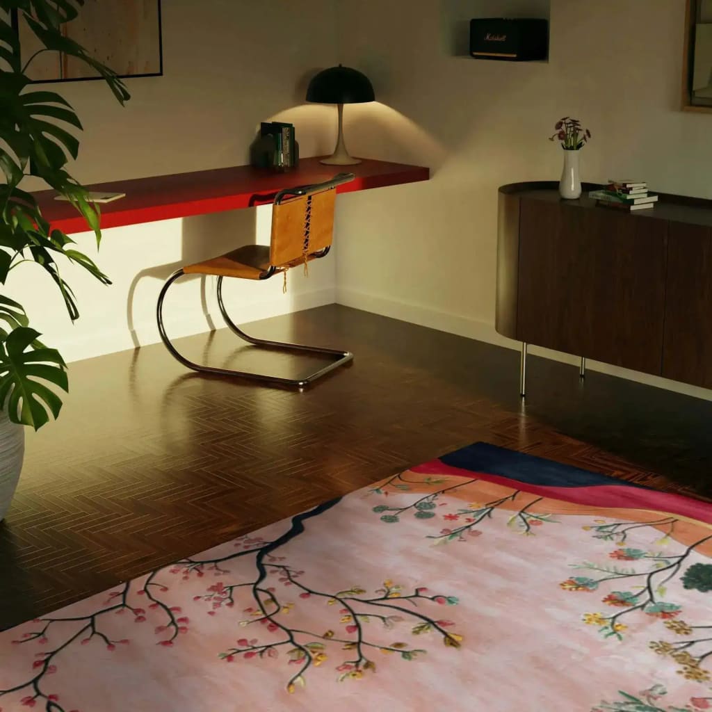 A cozy dining room featuring a Meadow Vista Hand Tufted area rug, perfect for under a dining table. The wool rug showcases a beautiful floral pattern in soft colors, adding warmth and elegance to the space. Ideal for large area rugs in living rooms or dining areas, the design complements the modern furniture and decor.