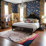 Meadow vista hand-tufted rug with cherry blossom and rolling hill scene in cream, pink and navy bedroom