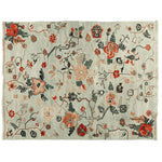 This beautiful hand-knotted area rug features meandering floral vines in vibrant shades of red, orange, and green, set against a soft, neutral background. Perfect for adding a touch of elegance to your living room, this 8x10 wool rug combines timeless floral patterns with contemporary style, making it an ideal choice for area rugs for living room spaces.