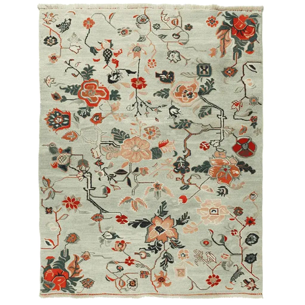 A beautifully hand-knotted area rug featuring intricate meandering floral vines in vibrant colors. This wool rug is perfect for adding elegance to your living room. Ideal as an 8x10 area rug for living room spaces.