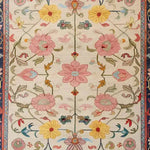 A beautifully detailed Medallion Bloom Hand Knotted Area Rug featuring vibrant floral patterns with pink, yellow, and blue flowers. This vintage rug is perfect for adding a touch of elegance to large living rooms. The intricate Persian design makes it an ideal choice for those seeking a floral rug or rugs for living room spaces.