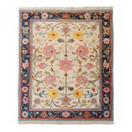 The Medallion Bloom Hand Knotted Area Rug showcases an intricate floral design with vibrant colors, ideal for large living rooms. This vintage Persian-style rug features a detailed border and central medallion, embodying the elegance of traditional rugs for living room spaces.