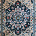 A detailed view of the Medallion Hand Tufted Rug, showcasing its intricate Persian design. This vintage wool area rug is perfect for a dining room under a dining table or as a centerpiece in a large living room. The rich, ornate patterns and traditional colors add elegance and charm to any living space.