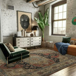 Modern living room with a green sofa, white dresser, a cream and red hand knotted rug, and large window.