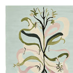 A beautifully crafted area rug showcasing an abstract floral design in shades of green and pink on a soft blue background. This wool rug is perfect for adding a touch of elegance to large living rooms, making it a standout piece among area rugs for living room decor.