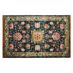 Top view of the Midnight Bloom Mosaic Hand Tufted Area Rug, showcasing a vibrant floral design with pink and green patterns on a dark background. This wool rug is perfect for large living rooms, adding a touch of elegance to any space.