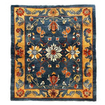 The Midnight Blossom Heritage Hand Tufted Rug features a stunning floral design with vibrant colors, perfect for enhancing your dining room or living room. This vintage wool area rug showcases intricate patterns that add elegance to any formal dining room setting.