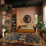 Elegant dining room featuring a Midnight Blossom Heritage Hand Tufted Area Rug. This vintage floral rug, perfect for both living room and formal dining room settings, is crafted from luxurious wool. Its intricate design and vibrant colors add a touch of sophistication and warmth to the space.