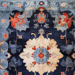 This stunning area rug features an intricate floral design with rich blue, red, and cream colors, perfect for adding a touch of vintage elegance to living rooms or offices. The Midnight Blossom Tapestry is hand-tufted from wool, making it a luxurious 8x10 living room rug that embodies the charm of a vintage floral rug.