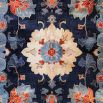 Vibrant Midnight Blossom Tapestry Hand Tufted Area Rug featuring intricate floral patterns in blue, red, and beige tones. Ideal for living room rugs 8x10, this vintage wool rug adds elegance to both living room and office spaces.
