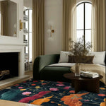 A beautifully styled living room featuring the Midnight Garden Hand Tufted Area Rug. This wool rug showcases a vibrant floral design, perfect for adding a contemporary touch to a vintage-inspired space. Ideal for large living rooms, the rug complements the elegant decor with its rich colors and intricate patterns.