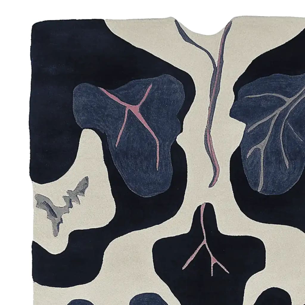 Close-up view of the Midnight Leaf Veins Hand Tufted Area Rug, showcasing its contemporary abstract design with intricate leaf vein patterns in dark blue and cream tones. Perfect wool rug for adding a stylish touch to living rooms, available in 8x10 size.