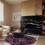 A stylish living room showcasing a Midnight Mirage Hand Tufted Area Rug. The wool rug features an intricate vintage design with rich, contrasting colors, perfectly accentuating the modern decor. Ideal as an area rug for living rooms, this 8x10 rug adds a touch of elegance and warmth.