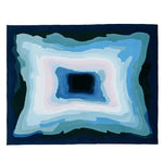 The Midnight Mirage Layers Hand Tufted Area Rug, a contemporary rug featuring a captivating abstract design with layered shades of blue and white, perfect for adding a modern touch to any living room. This wool rug measures 8x10, making it ideal for large living spaces.