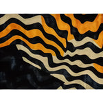 A striking Midnight Mirage Tufted Wool Rug featuring bold abstract waves in black, orange, and cream. This contemporary area rug is perfect for adding a modern touch to any living room with its vibrant design and large size, making it a standout wool rug choice for stylish interiors.