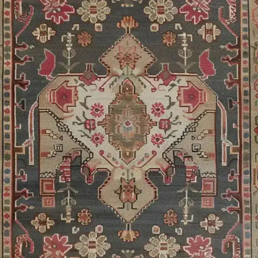 Close-up of a Midnight Mosaic Hand Knotted Area Rug featuring intricate Persian designs with floral patterns in rich reds and earthy browns on a dark background. Perfect for vintage-inspired living room decor, this 8x10 rug adds elegance and charm.