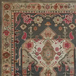 Close-up view of the Midnight Mosaic Hand Knotted Area Rug, showcasing its intricate vintage Persian-inspired design. This elegant living room area rug features an array of rich colors and detailed patterns, perfect for adding a touch of sophistication to 8x10 spaces.