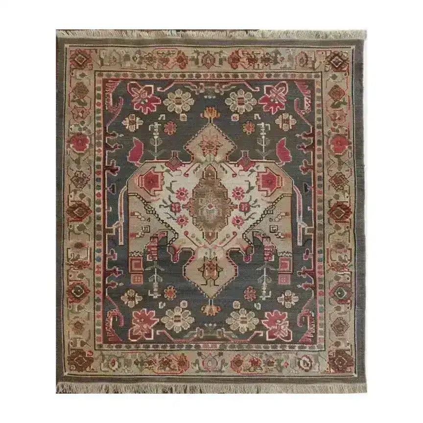 The Midnight Mosaic Hand Knotted Area Rug features an intricate vintage design with floral patterns and rich colors, ideal for enhancing the ambiance of any living room. This 8x10 Persian rug offers a timeless elegance that complements traditional and contemporary decor.