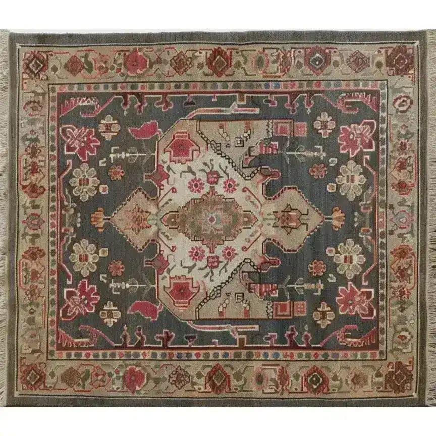 Top view of a Midnight Mosaic Hand Knotted Area Rug featuring an intricate Persian design with vintage charm. This 8x10 living room area rug showcases a rich palette of reds, blues, and beiges, perfect for adding elegance to any space.