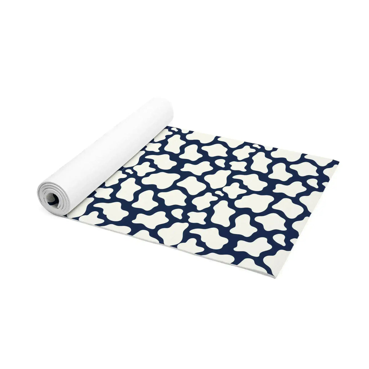 Partially rolled navy and white mosaic yoga mat angled to show its full patterned surface