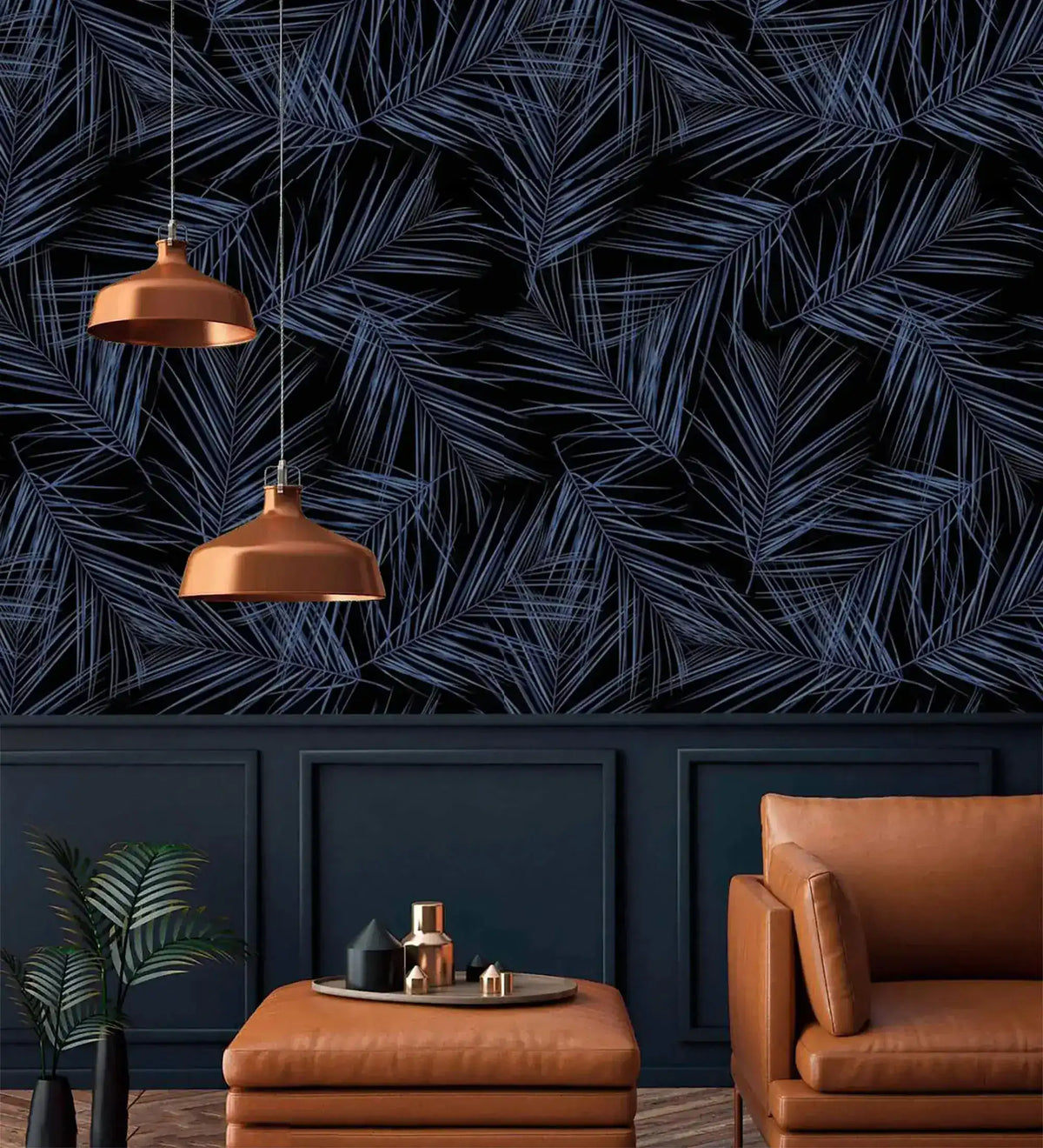 Midnight Oasis dark navy tropical palm wallpaper above navy wainscoting; copper pendants, tan leather chair and ottoman