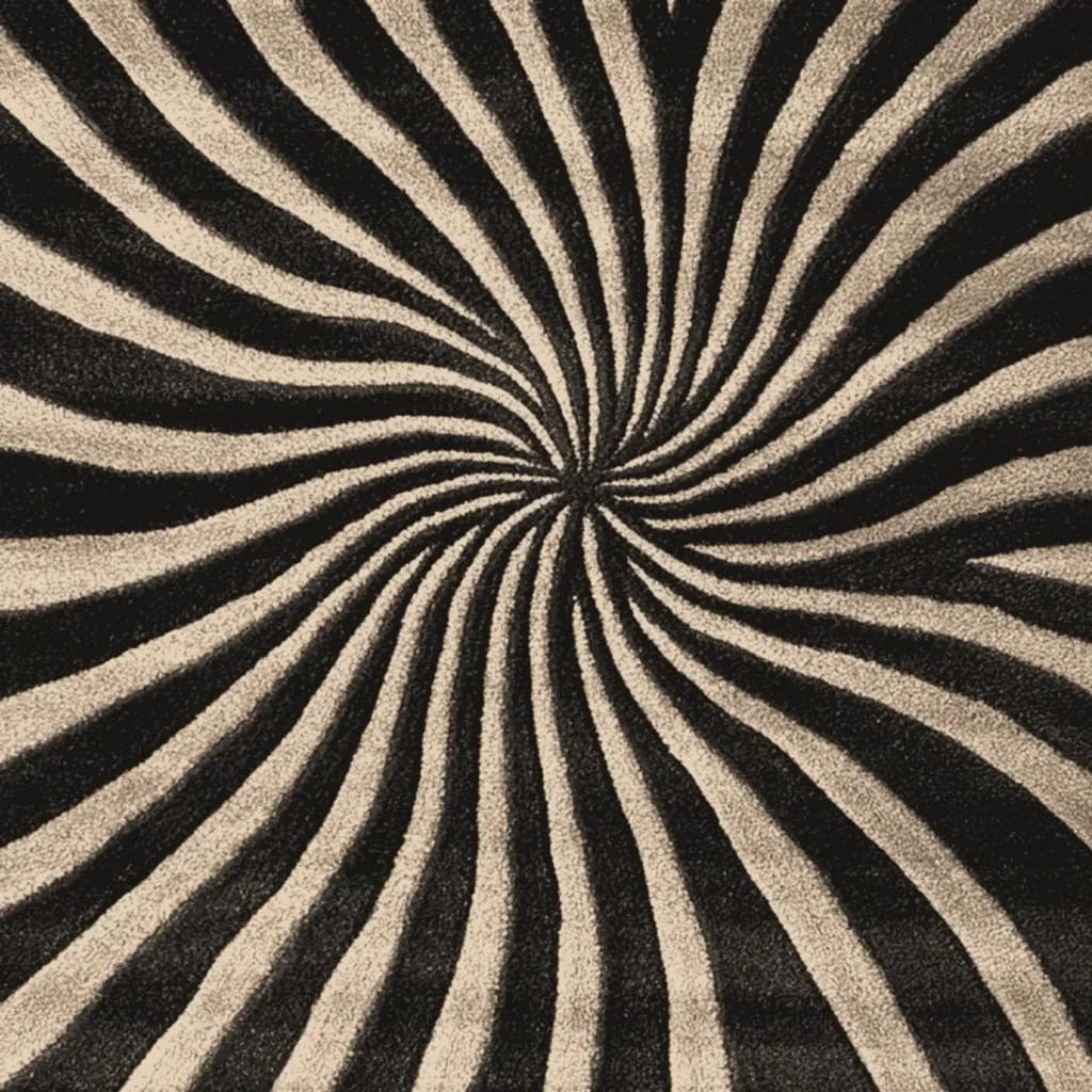 Top view of the Midnight Spiral Dance Hand Tufted Area Rug, showcasing its mesmerizing black and white spiral pattern. This contemporary wool rug is perfect for adding a touch of modern elegance to any living room.