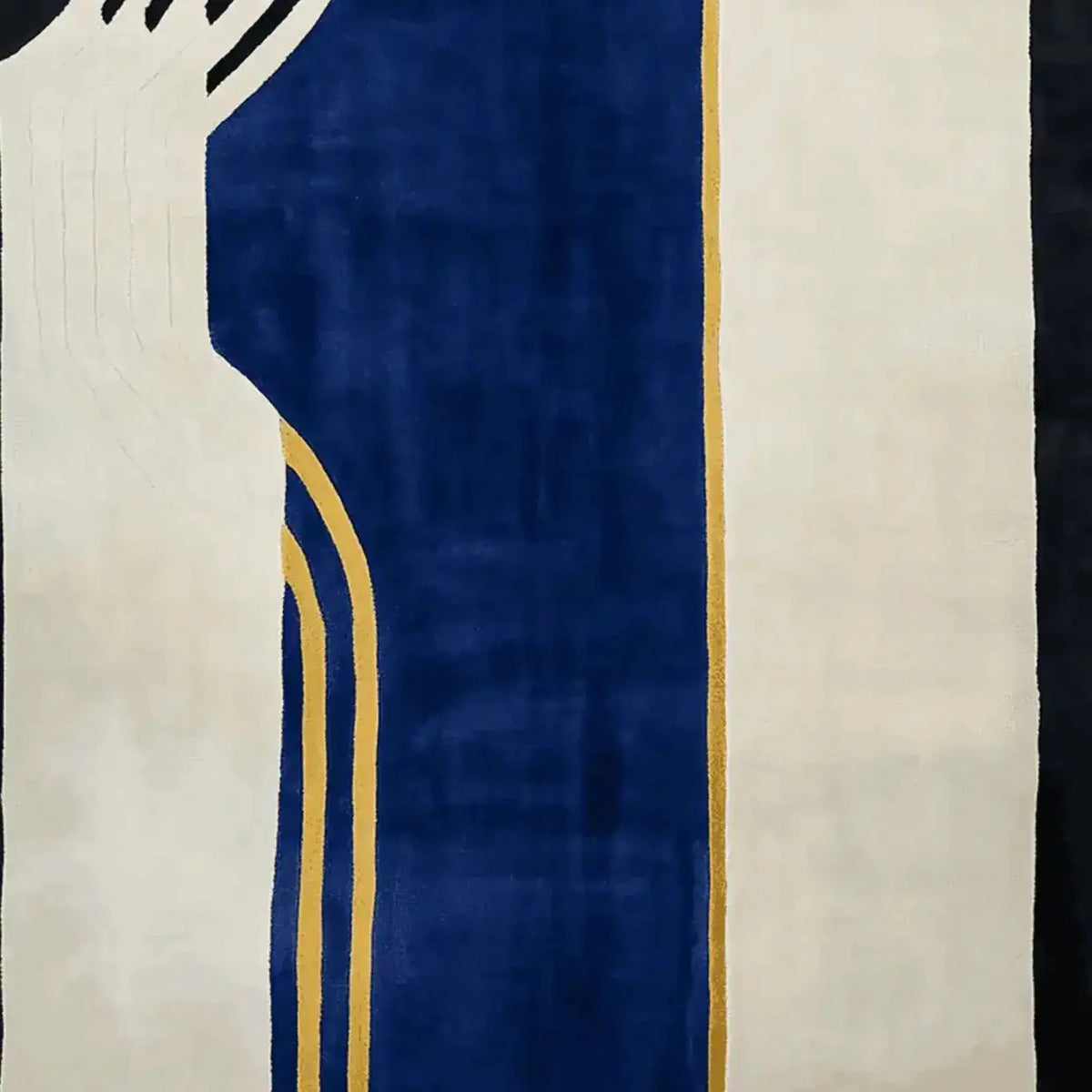 Contemporary wool rug with bold geometric patterns in deep blue, ivory, and gold, perfect for enhancing large living room spaces. This hand-tufted area rug adds a modern touch to any interior, making it an ideal choice for those seeking stylish living room area rugs.