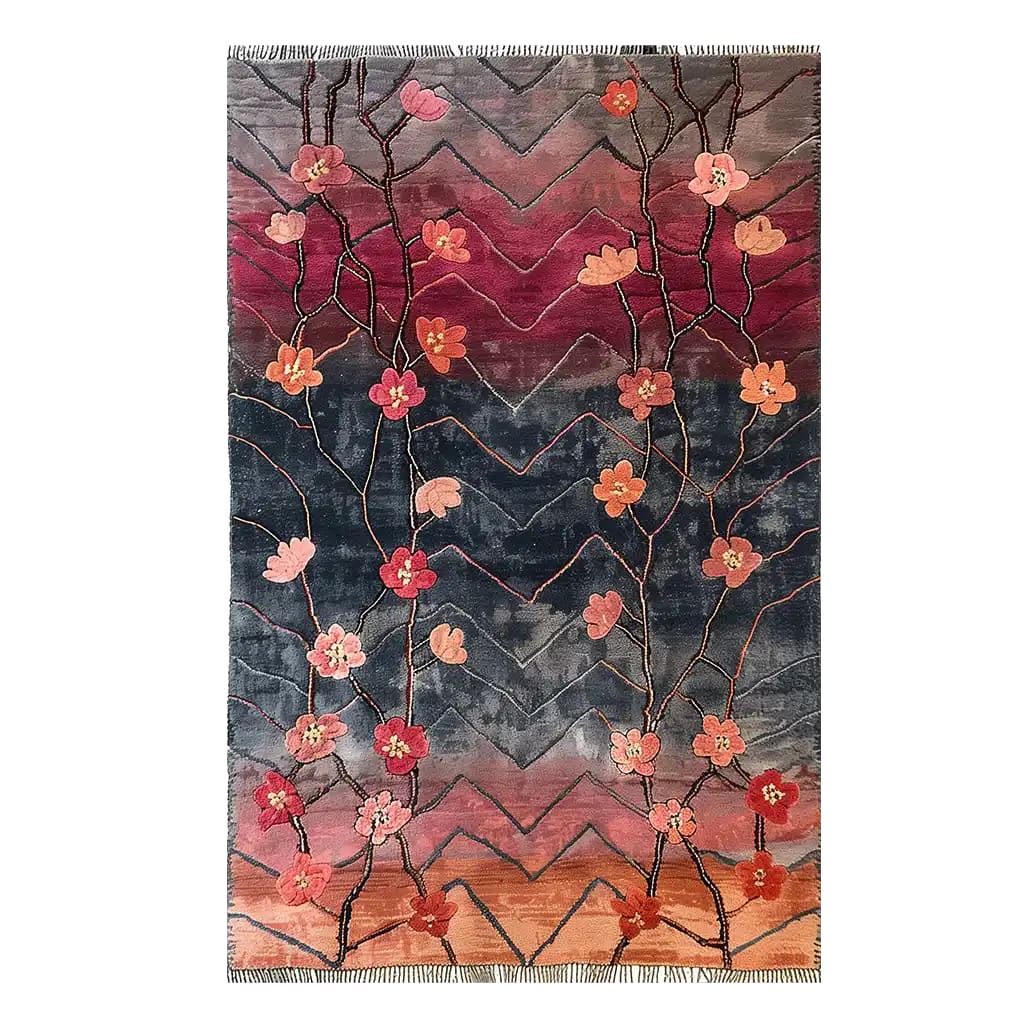 A beautiful area rug titled 'Midsummer Veil Knotted Wool Rug' featuring a vibrant floral design. The wool rug showcases a blend of pink and orange flowers against a dark gradient background, perfect for adding a touch of elegance to your living room. Ideal for living room spaces, this 8x10 rug combines artistry with functionality.