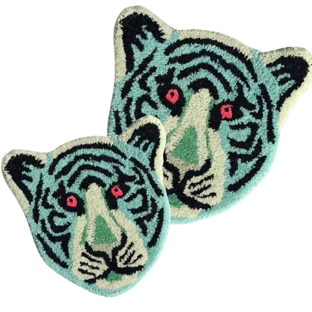 Vibrant Blue Tiger Face Hand-Tufted Wool Accent Rug, perfect for adding a bold statement to your office or living room. This unique area rug features an abstract tiger design in striking blue and black, ideal for enhancing any space with its artistic flair. A must-have wool rug for transforming your living room into a stylish haven.