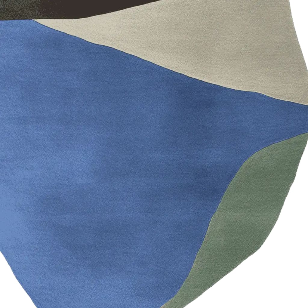 This image features a contemporary area rug in an abstract design, showcasing a blend of blue, beige, black, and green hues. The hand-tufted wool rug adds a modern touch to any living room, ideal for those seeking stylish area rugs for their living space.