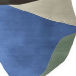 This image features a contemporary area rug in an abstract design, showcasing a blend of blue, beige, black, and green hues. The hand-tufted wool rug adds a modern touch to any living room, ideal for those seeking stylish area rugs for their living space.