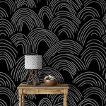 Minimalist Midnight Lines wallpaper with white scallop arches behind a rustic console and lamp